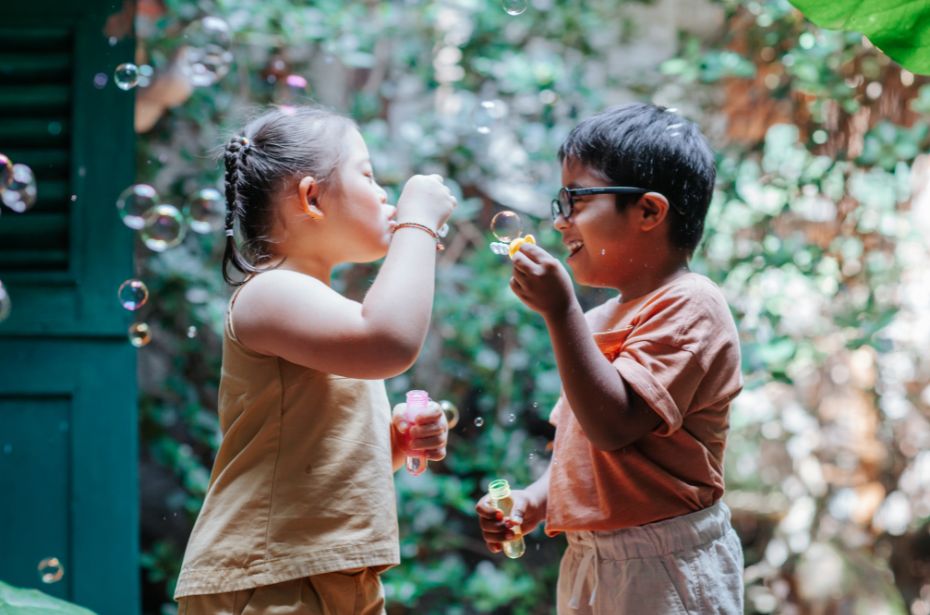 Understanding Neurodiversity and embracing differences children playing blowing bubbles