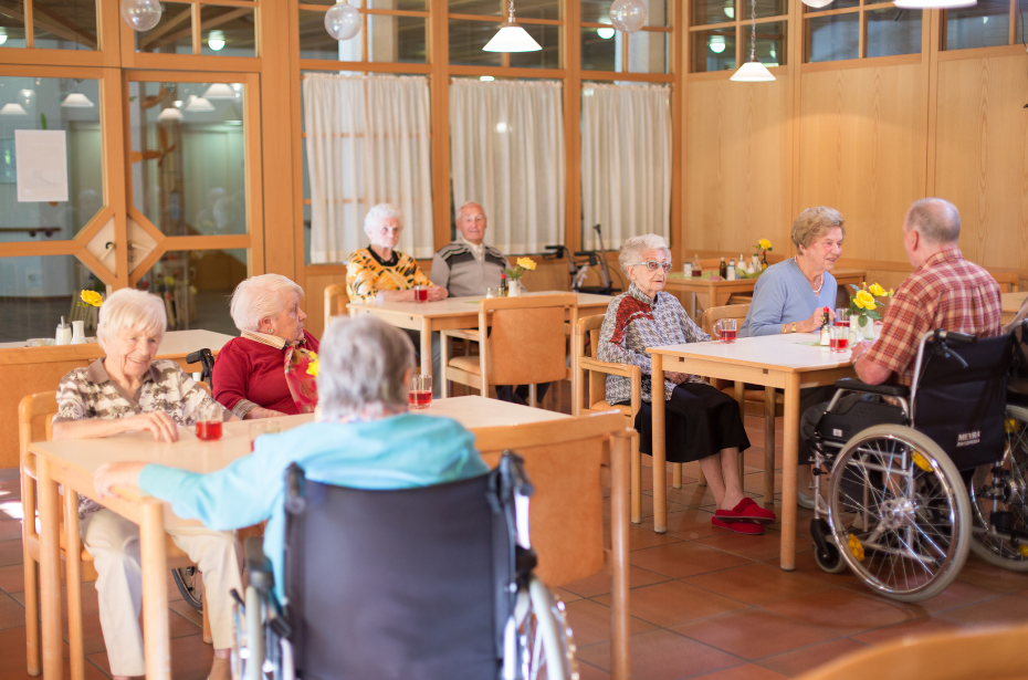 nursing home residents care wheelchair community gathering meeting