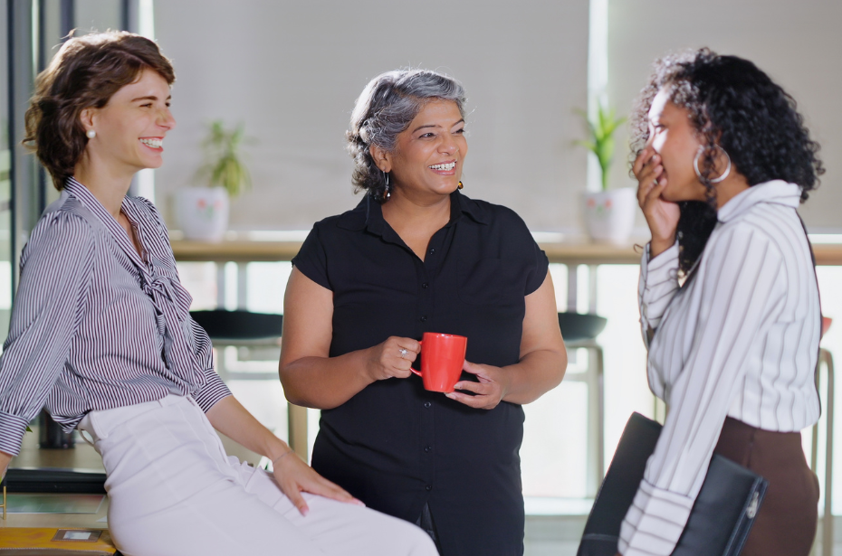 support workers office chatting talking discussing co-worker smiling enthusiastic skills